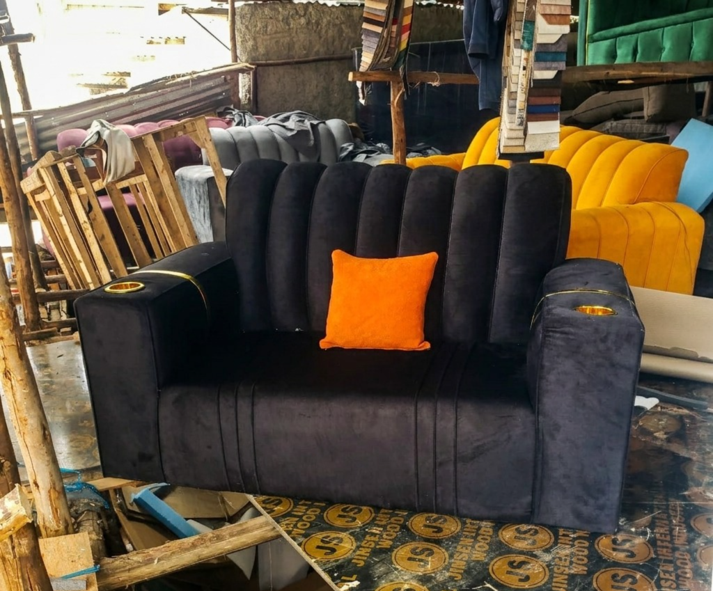 Velvet two-seater sofa with cup holders