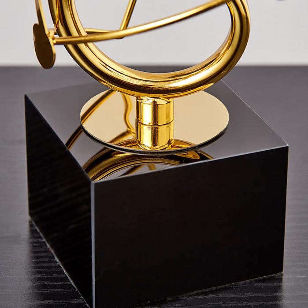 Golden Musical Harmony Sculpture - Treble Clef Armillary Sphere with Notes, Elegant Black Base Modern Art Decor