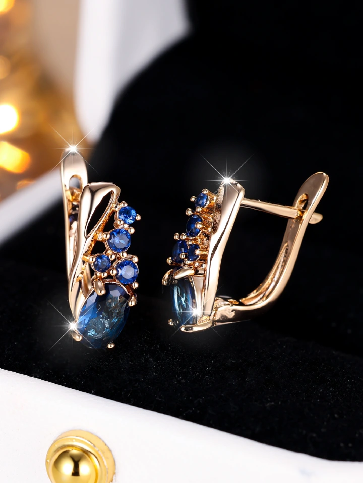 Champagne gold earrings with four small round diamonds and oval cubic zirconia stones - elegant, fashionable, and vintage style for women.