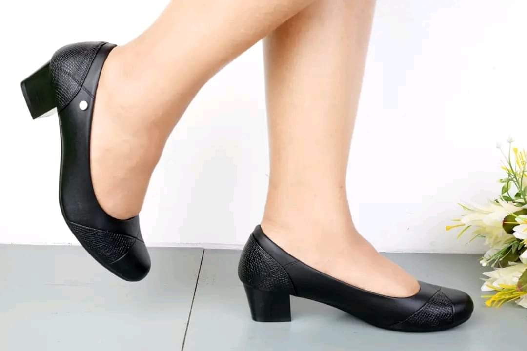 LATEST Comfortable High End ladies low heeled shoes featuring a block heel and textured detailing.