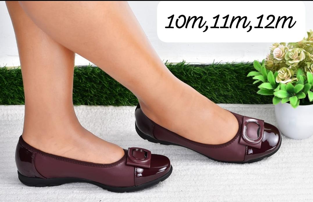 Comfortable Simple High Quality  flat shoes with black patent accents and a buckle detail.
