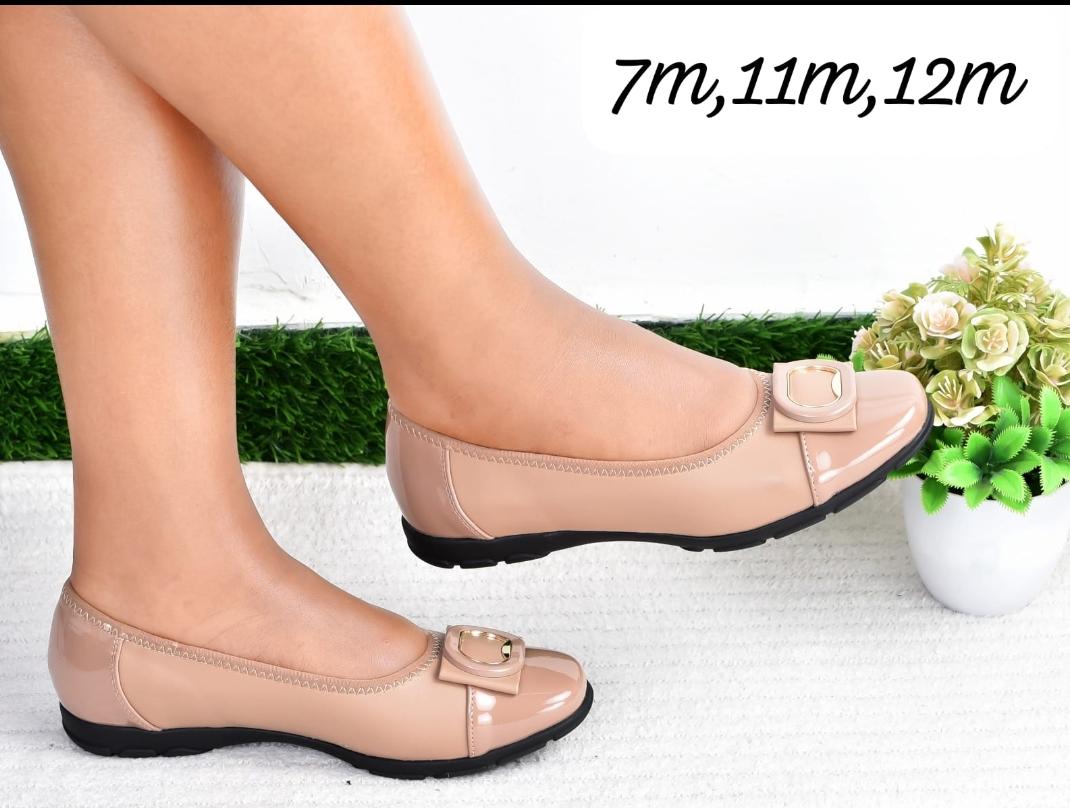 Comfortable Simple High Quality  flat shoes with black patent accents and a buckle detail.