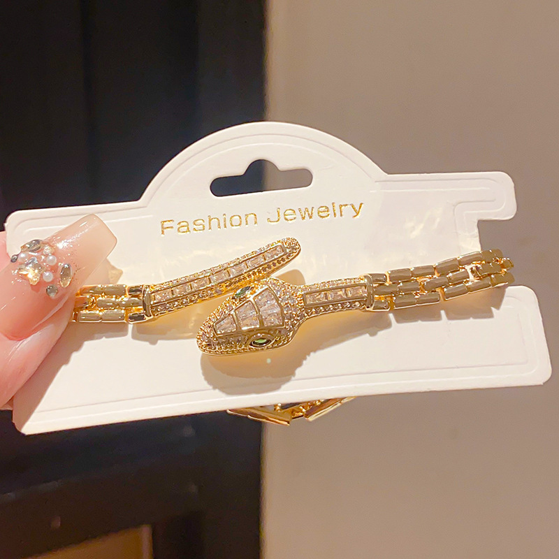 18k real gold plated light luxury style zircon snake-shaped buckle bracelet, European and American personality fashion niche high-end hand jewelry.