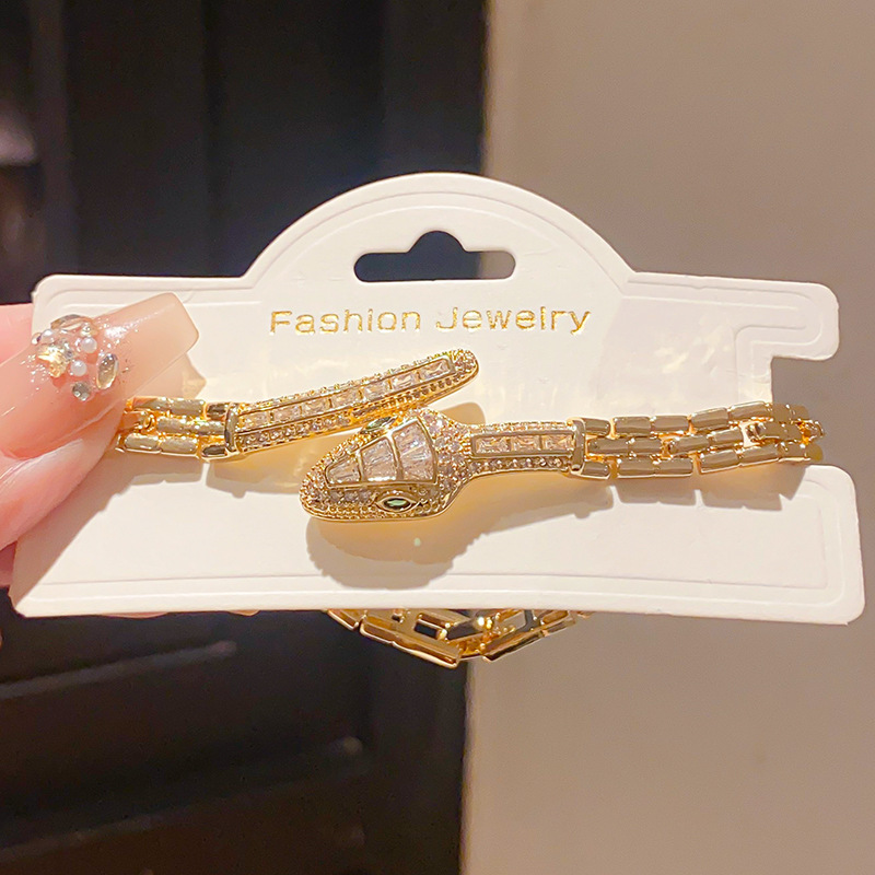 18k real gold plated light luxury style zircon snake-shaped buckle bracelet, European and American personality fashion niche high-end hand jewelry.