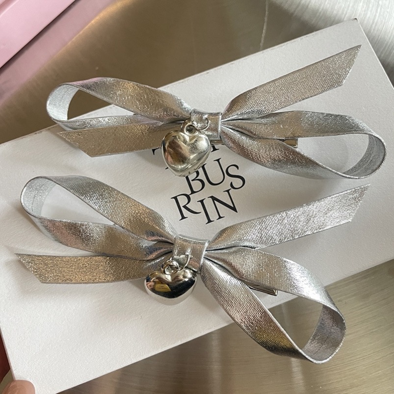 Korean-style new sweet and cool girl silver bow hair clip, niche personality heart-shaped hairpin top clip headwear wholesale