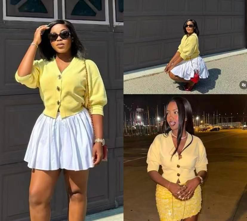 A knitted cardigan or sweater top characterised by its prominent silver/gold-tone heart-shaped buttons and has a slightly cropped length with long, voluminous balloon sleeves that end in ribbed cuffs.