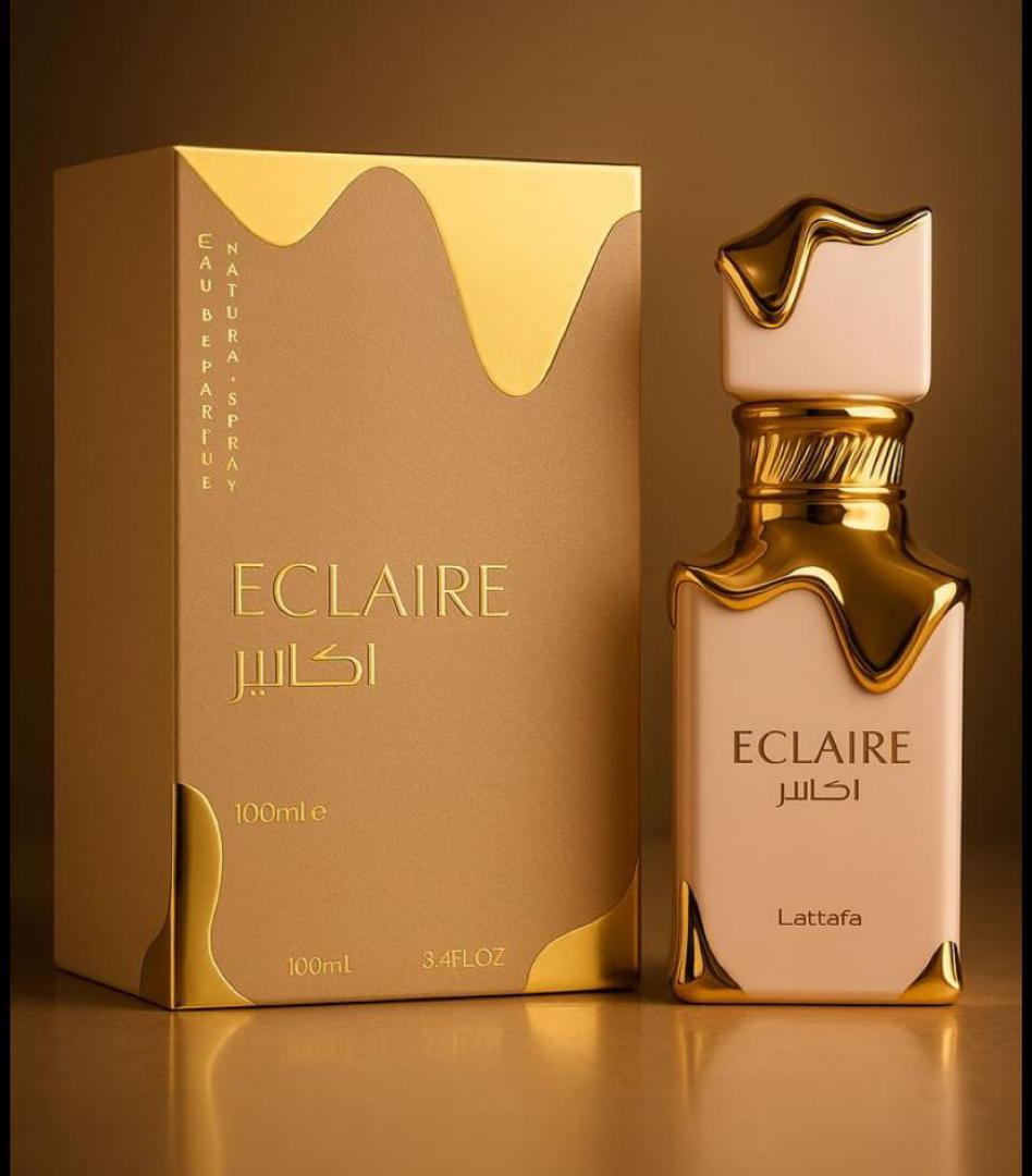 50 Ml Lattafa Eclaire Pink bottle with gold drip. Creamy gourmand scent of caramel, milk, honey, vanilla. Sweet, cozy, dessert-like.