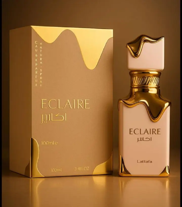 50 Ml Lattafa Eclaire Pink bottle with gold drip. Creamy gourmand scent of caramel, milk, honey, vanilla. Sweet, cozy, dessert-like.
