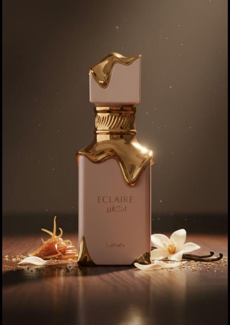 50 Ml Lattafa Eclaire Pink bottle with gold drip. Creamy gourmand scent of caramel, milk, honey, vanilla. Sweet, cozy, dessert-like.