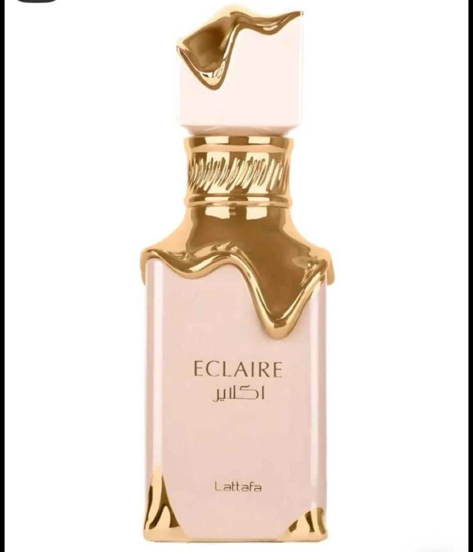 50 Ml Lattafa Eclaire Pink bottle with gold drip. Creamy gourmand scent of caramel, milk, honey, vanilla. Sweet, cozy, dessert-like.
