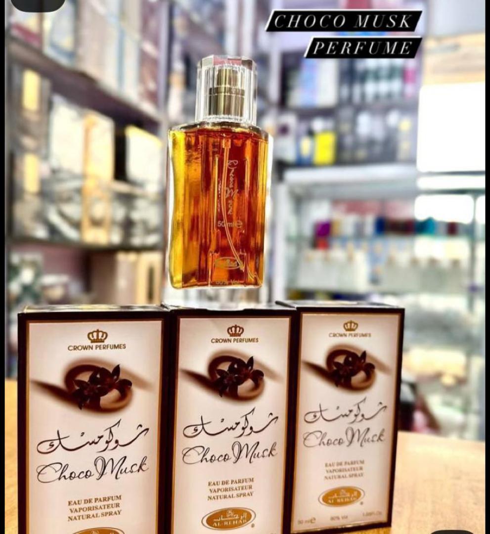 Choco Musk by Al-Rehab is a 50ml Eau de Parfum with a warm, sweet chocolate gourmand scent. The amber liquid in a clear glass bottle offers a cozy, indulgent aroma blending chocolate, vanilla, musk.