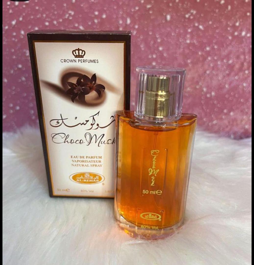 Choco Musk by Al-Rehab is a 50ml Eau de Parfum with a warm, sweet chocolate gourmand scent. The amber liquid in a clear glass bottle offers a cozy, indulgent aroma blending chocolate, vanilla, musk.