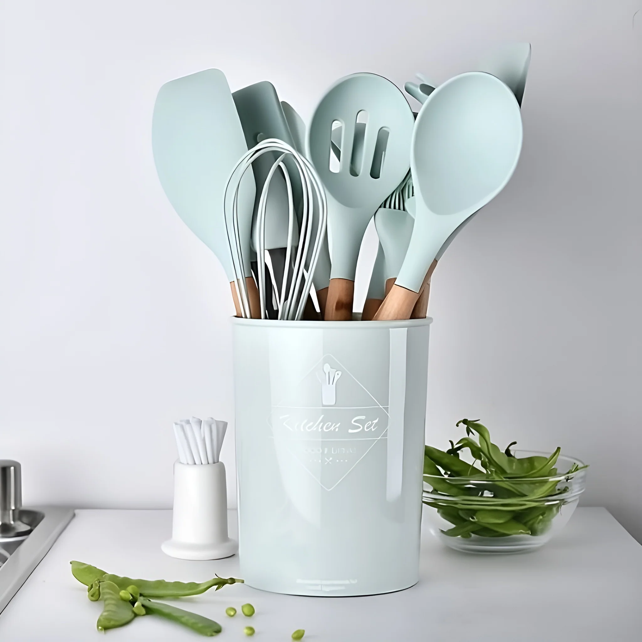 12-piece Silicone Kitchenware Set that includes Ladle Fork, Spoonula, Slotted Spoon, Kitchen Tong, Slotted turner, Whisk, Brush, Large Spatula, Small Spatula, Egg Separator and Holder.