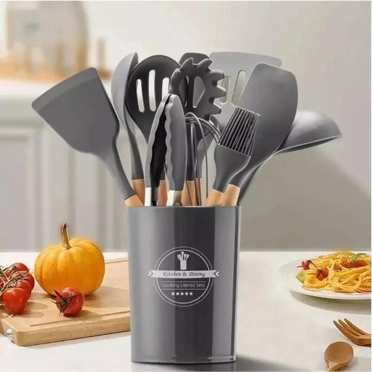 12-piece Silicone Kitchenware Set that includes Ladle Fork, Spoonula, Slotted Spoon, Kitchen Tong, Slotted turner, Whisk, Brush, Large Spatula, Small Spatula, Egg Separator and Holder.