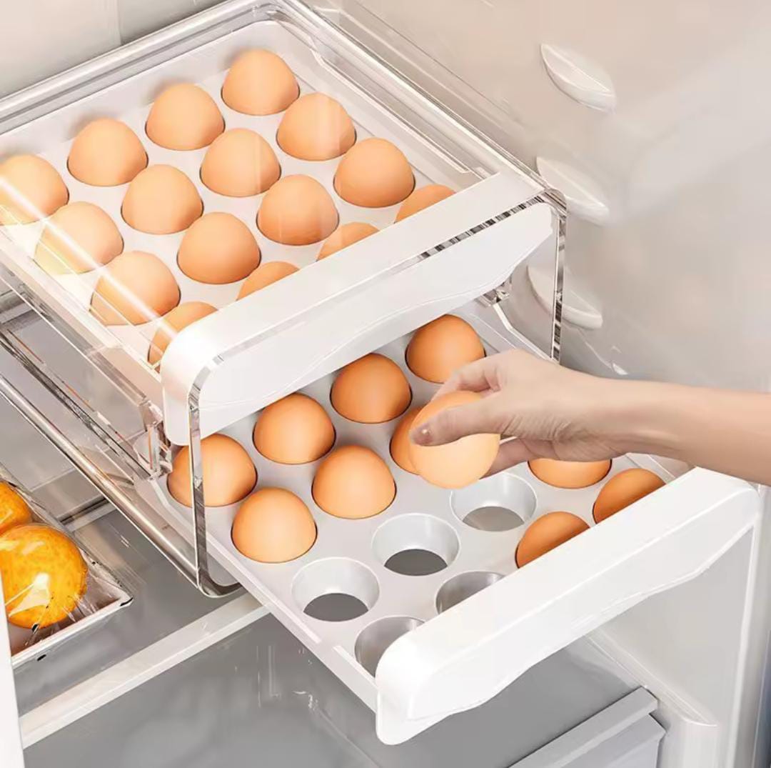 🥚✨ Fridge Egg Organizer Drawer – Neat, Space-Saving Storage ✨🥚🔥Keep your fridge neat and organized with this Double-Layer Egg Organizer Drawer. Designed to maximize sp