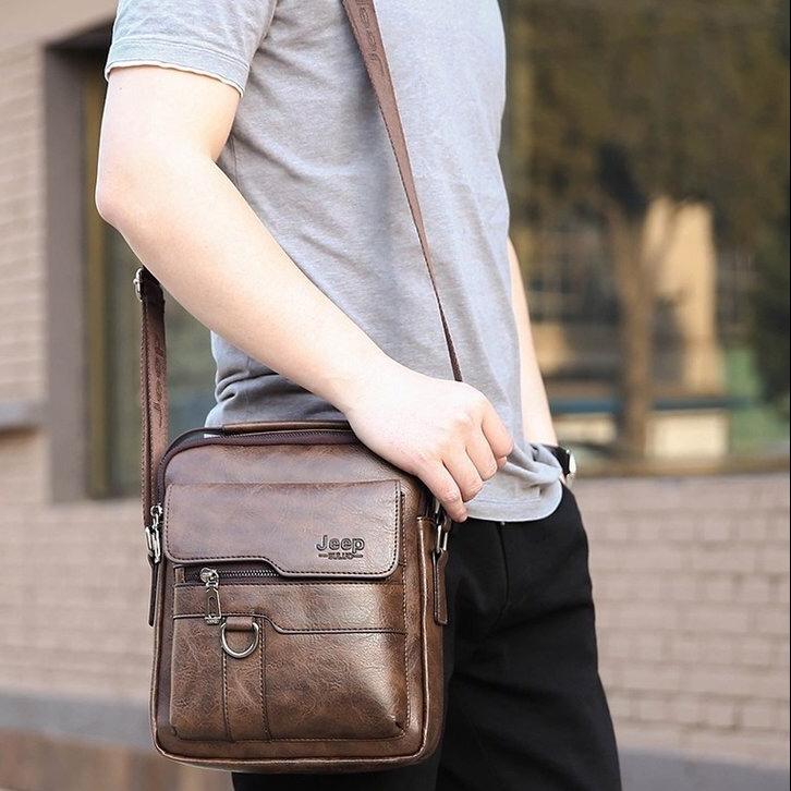 JEEP PU Leather Men’s Crossbody Sling Bag, Waterproof Messenger Chest Bag with USB Charging Port, Business Casual Shoulder Bag for Work Travel Black Brown