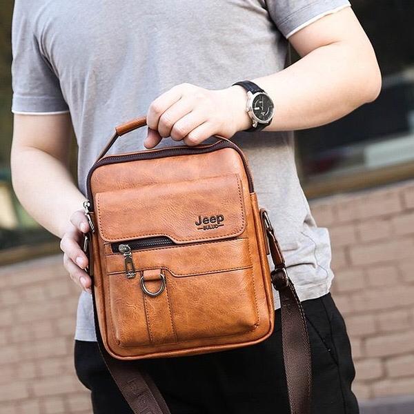 JEEP PU Leather Men’s Crossbody Sling Bag, Waterproof Messenger Chest Bag with USB Charging Port, Business Casual Shoulder Bag for Work Travel Black Brown