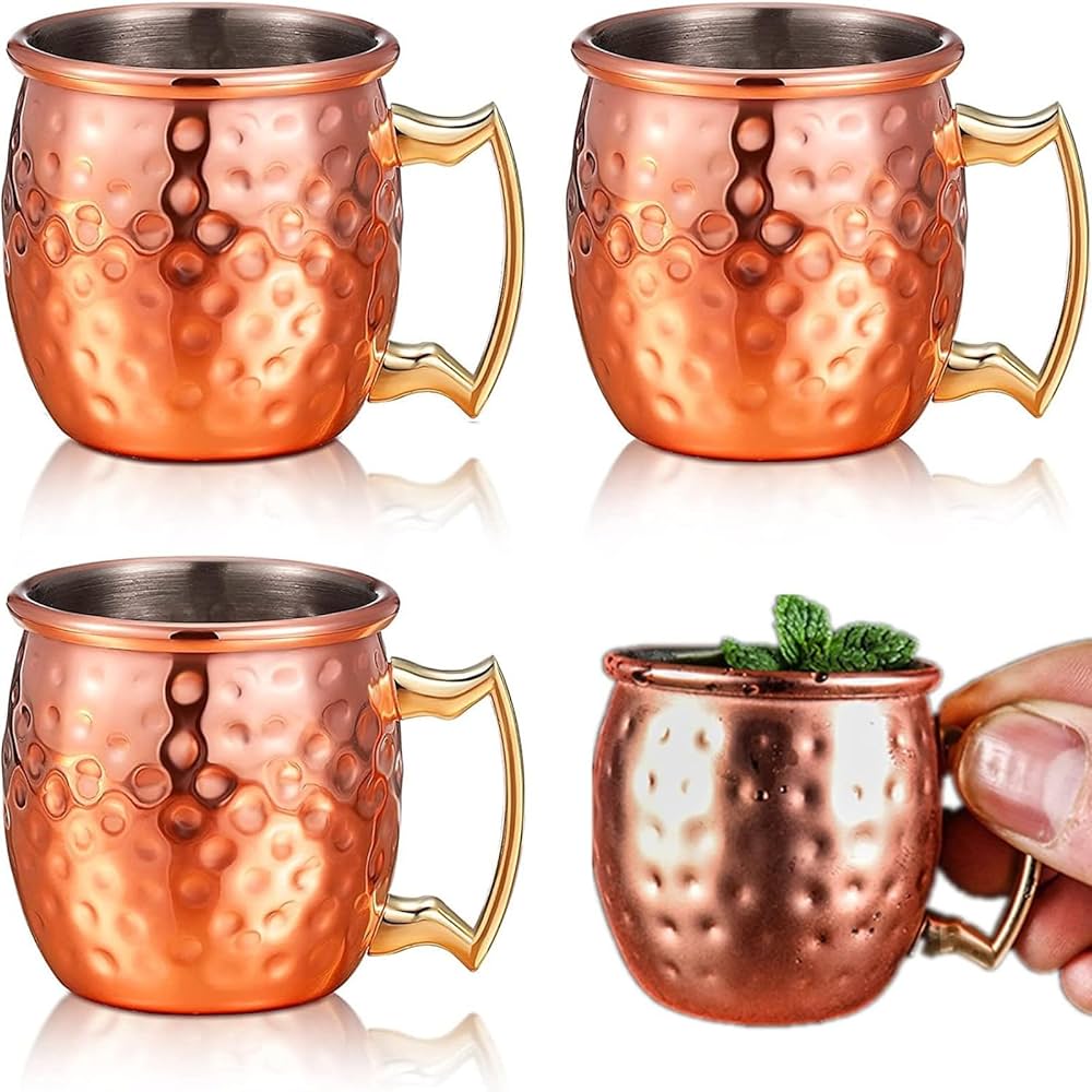 copper Moscow Mule mugs featuring brass handles and a polished finish mugs are traditionally used for serving Moscow Mules because the copper helps keep the drink chilled to enhance flavour .