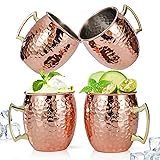 copper Moscow Mule mugs featuring brass handles and a polished finish mugs are traditionally used for serving Moscow Mules because the copper helps keep the drink chilled to enhance flavour .