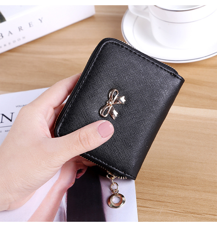 The New lovely Fresh Small wallet Bow tie zipper Coin Purse Female student Wild Hand bag