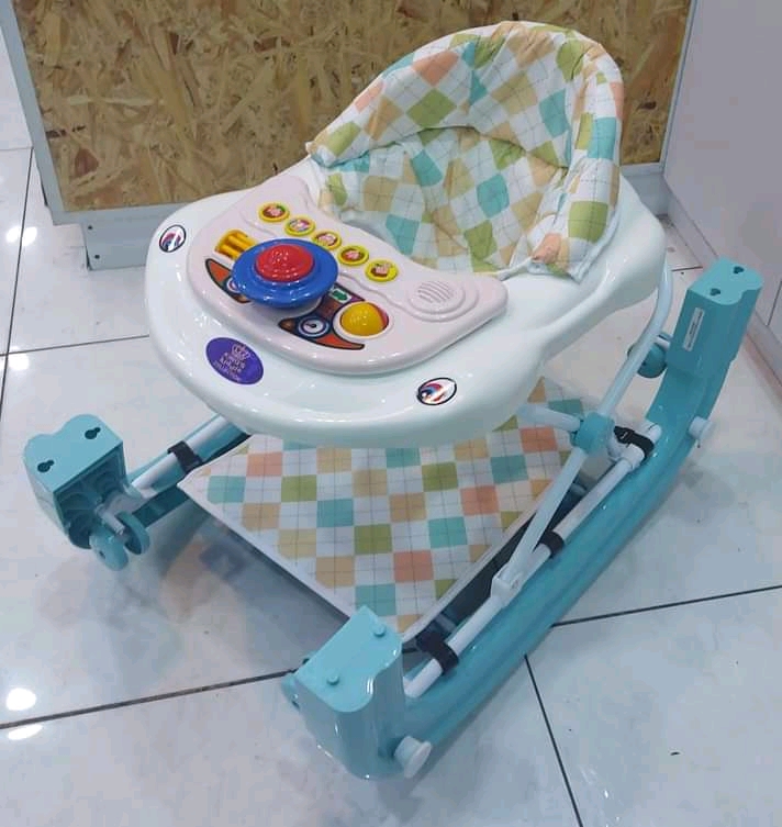 2-1 Baby walker and rocker.and still has music