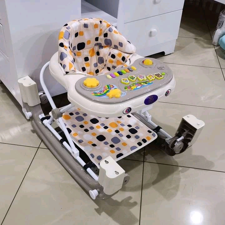 2-1 Baby walker and rocker.and still has music