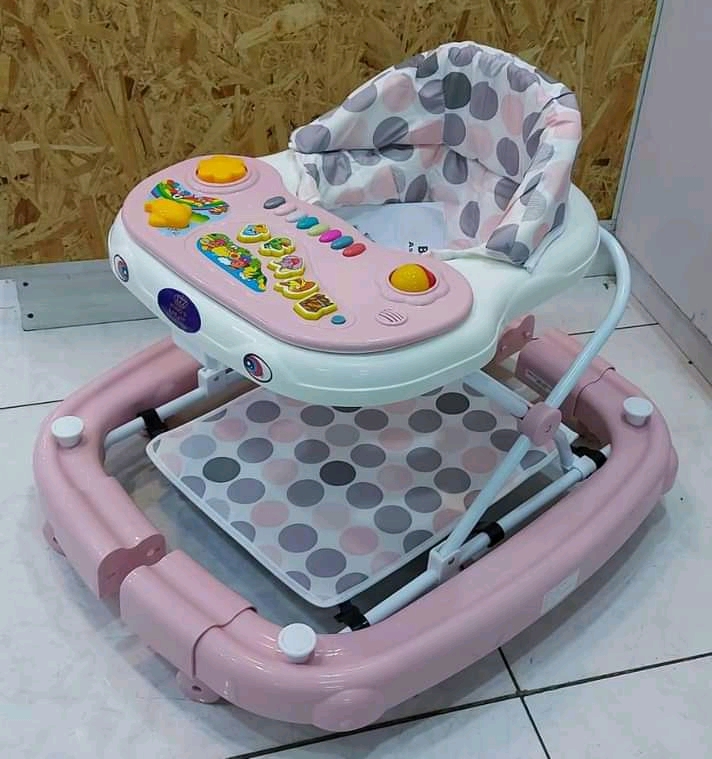 2-1 Baby walker and rocker.and still has music