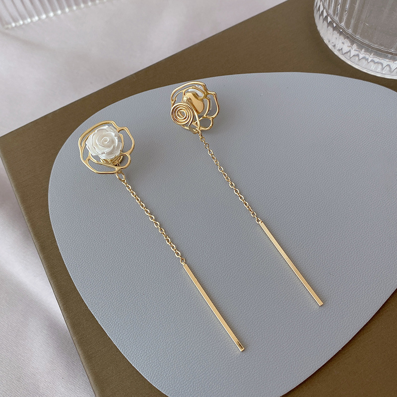 Hong Kong style flower tassel earrings temperament simple long earrings light luxury design mosquito coil plate without ear hole ear clip female