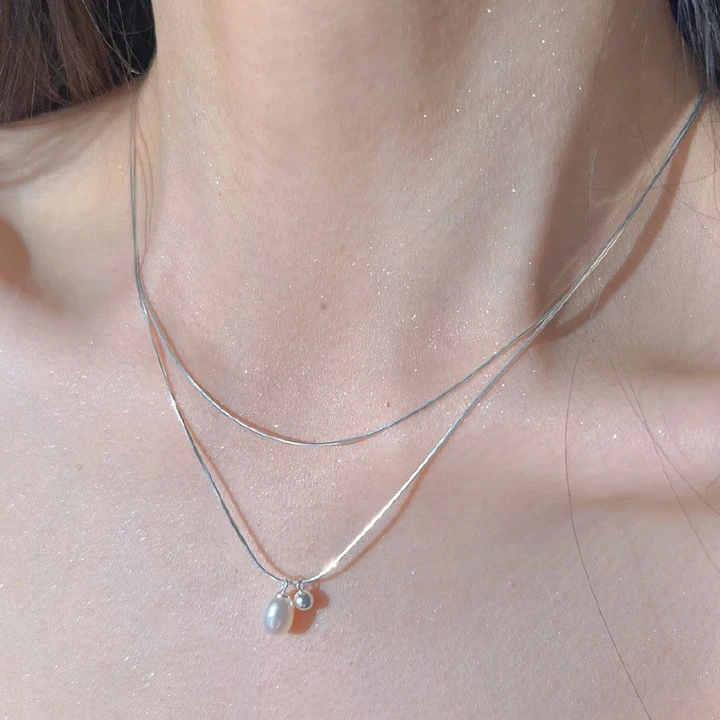 Fashion Trend Moonlight Stone Necklace for Women with Ethnic Minorities Design Advanced Oval Pendant Light Luxury Fashion Snake Bone Chain
